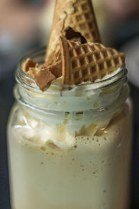 Closeup of cold coffee with whipped cream and waffle cone