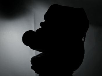 Side view of silhouette man against white background