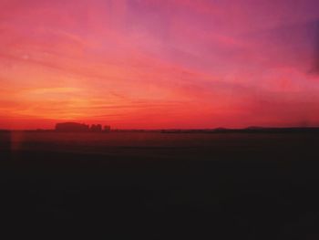 Scenic view of silhouette landscape against sky during sunset