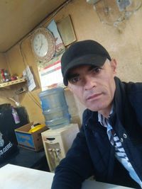 Portrait of man sitting in office