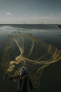 Fisherman in lake