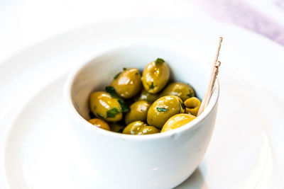 Close-up of olives served in bowl