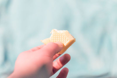 Close-up of hand holding ice cream