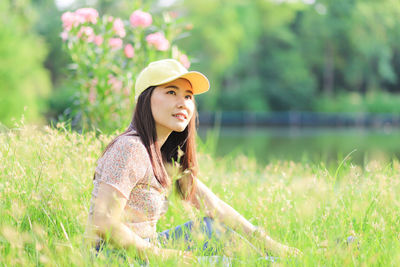 Young woman wearing hat on field