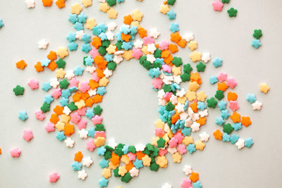 High angle view of multi colored candies on table