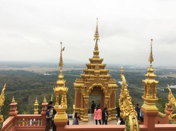 Group of people in temple against building