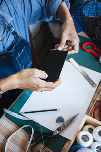 High angle view of man working on table