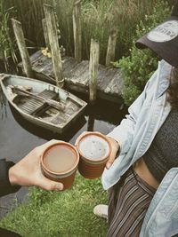 Rear view of man sitting on field