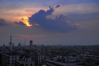 Cityscape against sky during sunset