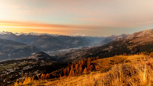 Scenic view of mountains against sky during sunset
