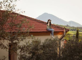 View of a horse on roof against buildings