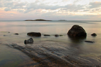 Scenic view of sea against cloudy sky