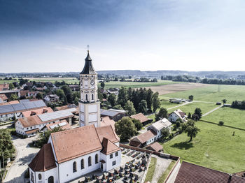 High angle view of houses in town against sky