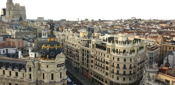 High angle view of city buildings against clear sky