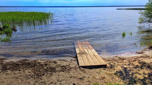 High angle view of wooden posts on beach