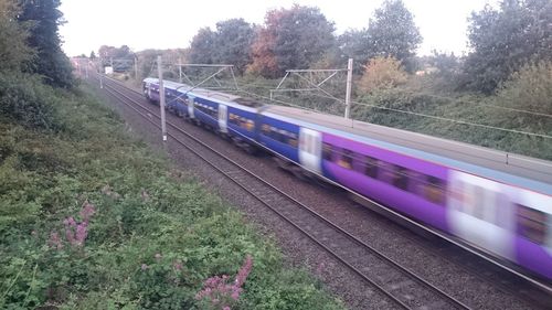 Train on railroad track against sky