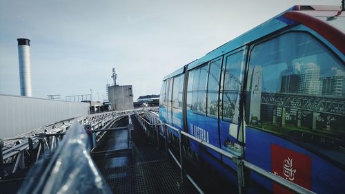 Train in city against sky