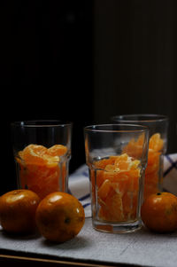 Close-up of orange juice in glass on table