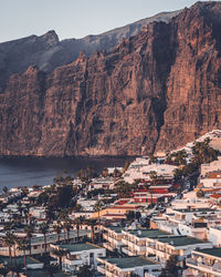 High angle view of townscape by sea