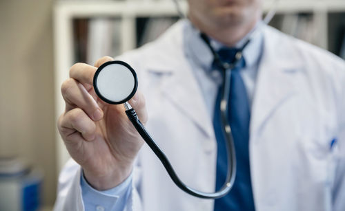 Close-up of doctor holding stethoscope