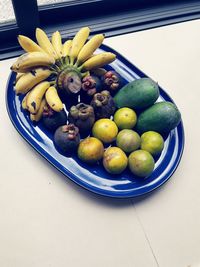 Close-up of fruits in tray on table