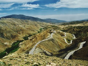 Scenic view of landscape and mountains against sky