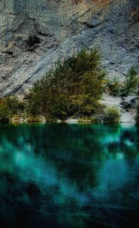 Reflection of trees in lake against sky