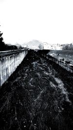 Road leading towards clear sky