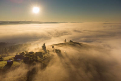 Mountain landscape with morning fog, at the forest edge, in bukovina, romania