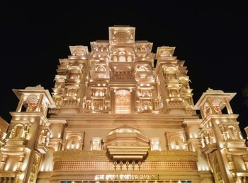 Low angle view of illuminated building at night