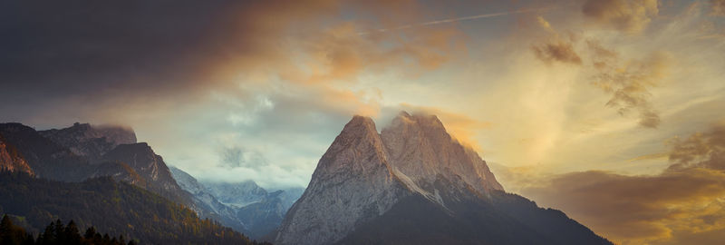 Panoramic view of mountains against dramatic sky