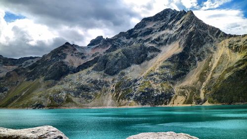 Scenic view of lake and mountains against sky