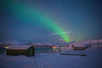 Illuminated house at night during winter