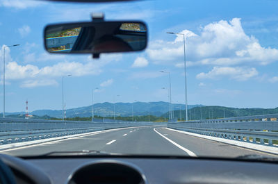 Road seen through car windshield