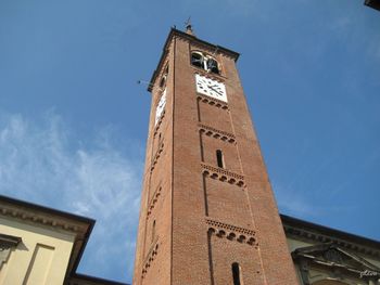 Low angle view of clock tower against sky