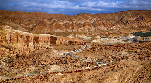 Aerial view of landscape with mountain range in background