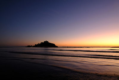 Scenic view of sea against sky at sunset