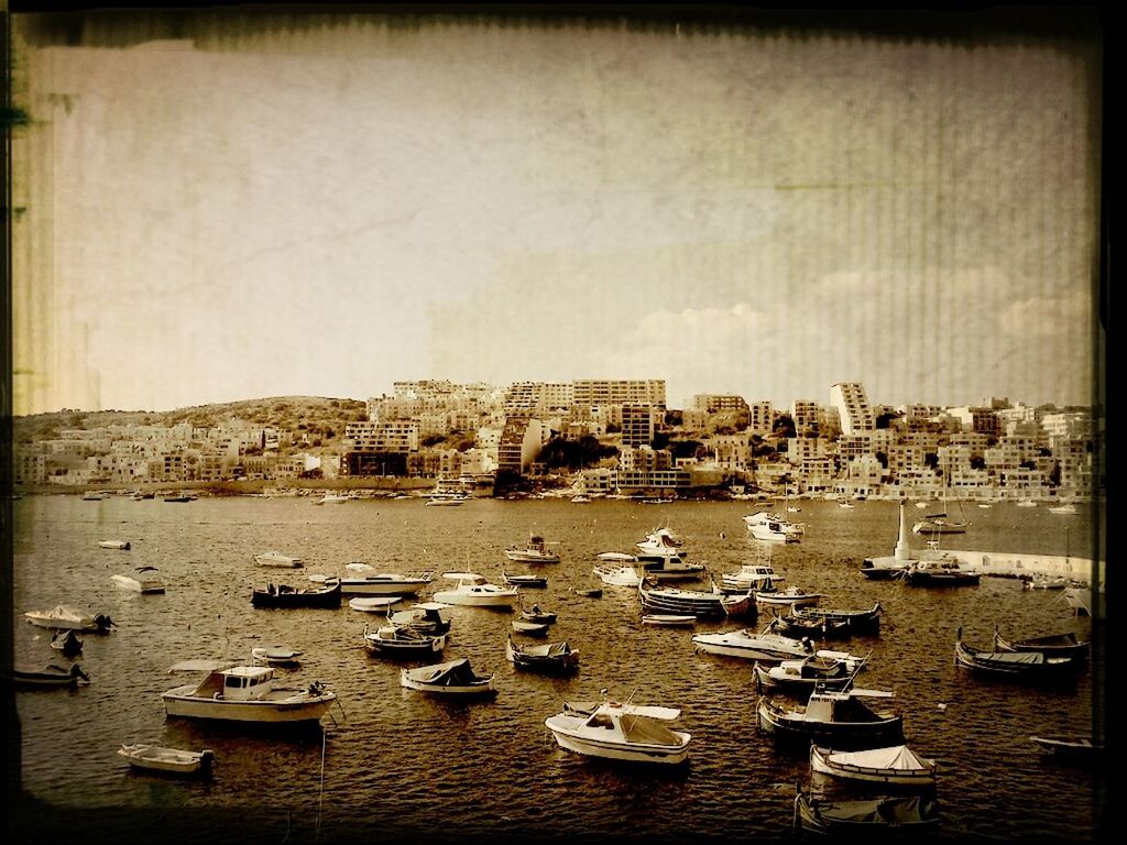 transfer print, auto post production filter, architecture, building exterior, built structure, water, city, sea, clear sky, day, harbor, no people, sky, outdoors, chair, copy space, high angle view, large group of objects, moored, cityscape