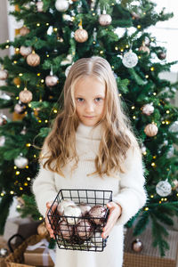 Portrait of girl with christmas tree