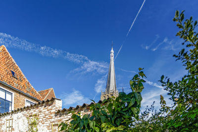 Low angle view of buildings against blue sky