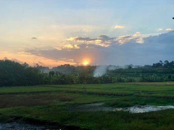 Scenic view of landscape against sky during sunset