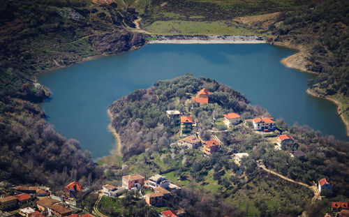 High angle view of river amidst trees against sky