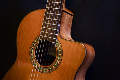 Close-up of guitar in the dark
