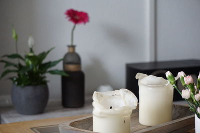 Close-up of white flower vase on table at home