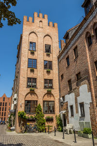 Low angle view of buildings against clear sky