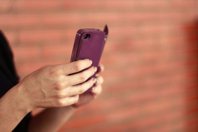 Close-up of woman using mobile phone