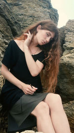 Beautiful young woman sitting in a temple