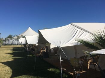 Built structures against clear blue sky