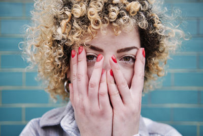 Close-up portrait of woman wearing mask