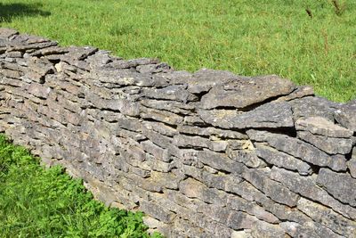 Stone wall on field